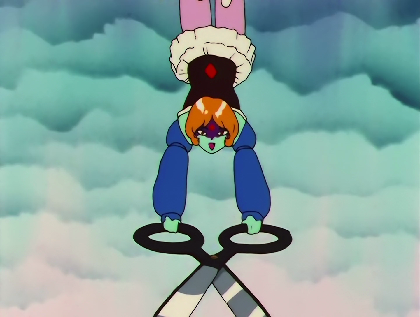 Buranko, a Lemures from Sailor Moon episode 138. She has turquoise skin and ginger hair, and the upper half of her face is painted purple with a red diamond symbol. Her outfit is blue and black, with a white tutu and pink leggings. She’s dangling from a trapeze by her legs, and wielding a giant pair of scissors. That’s it, that’s Buranko.